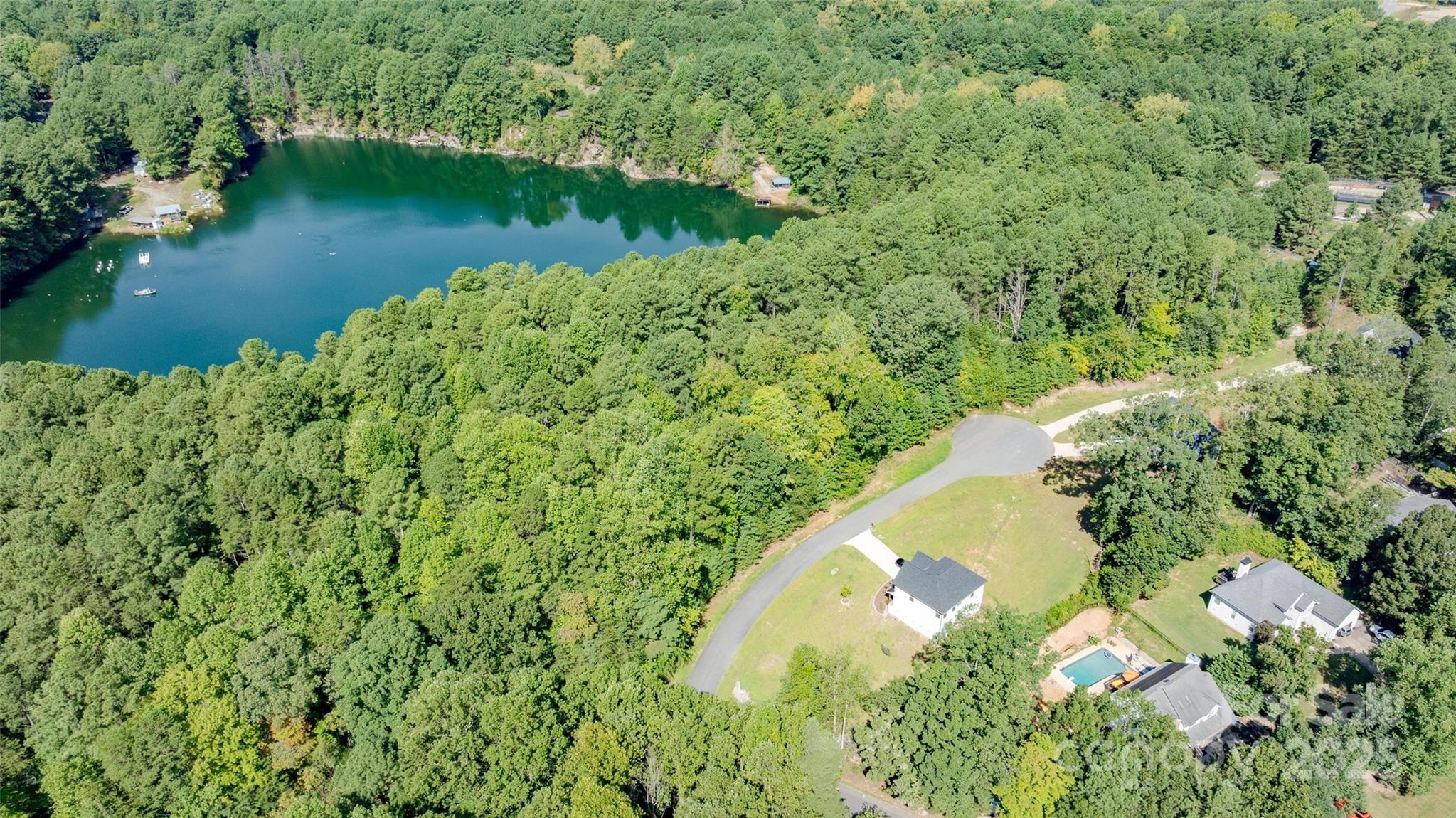 122 Ridgetop Road, Unit 4 Mooresville, NC 28117 - Photo 10 of 11 an aerial view of a house with a yard and lake view