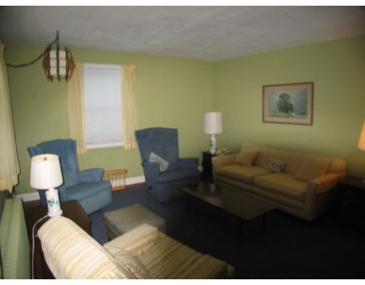 12 Rosa Road Middletown, RI 02842 - Photo 5 of 14 a living room with furniture and a lamp