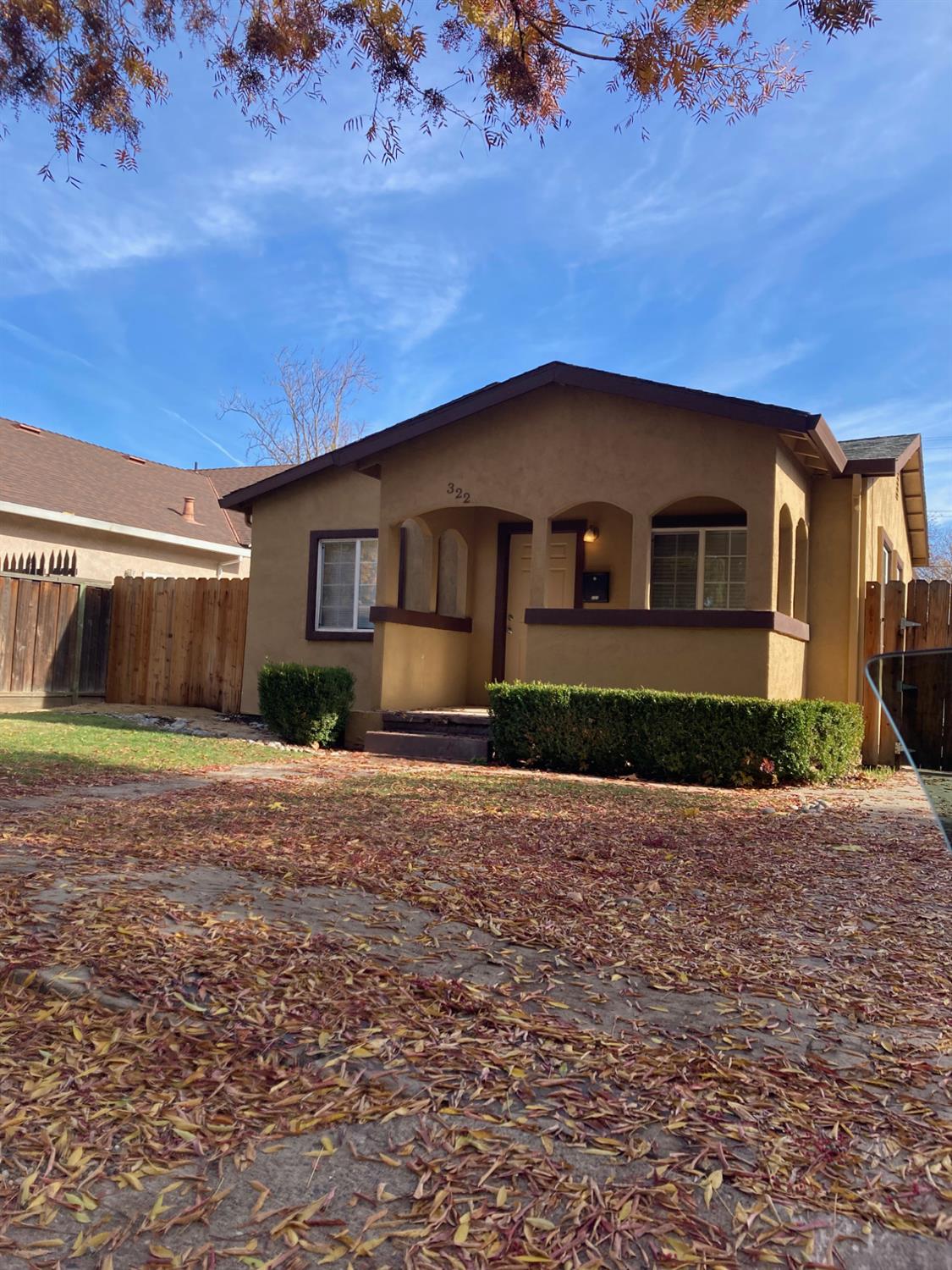 322 Johnson Street Modesto, CA 95354 - Photo 1 of 6 a front view of a house with a yard
