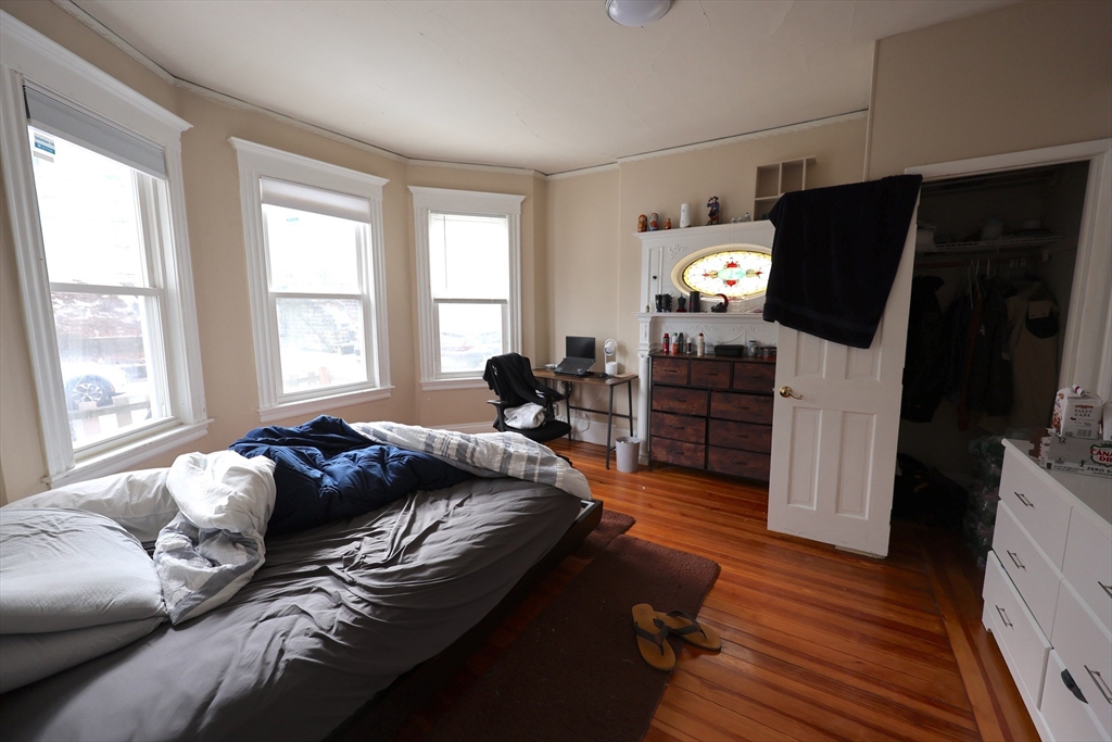 33-35 Ridgemont Street, Unit 1 Boston, MA 02134 - Photo 4 of 10 a living room with furniture and a flat screen tv