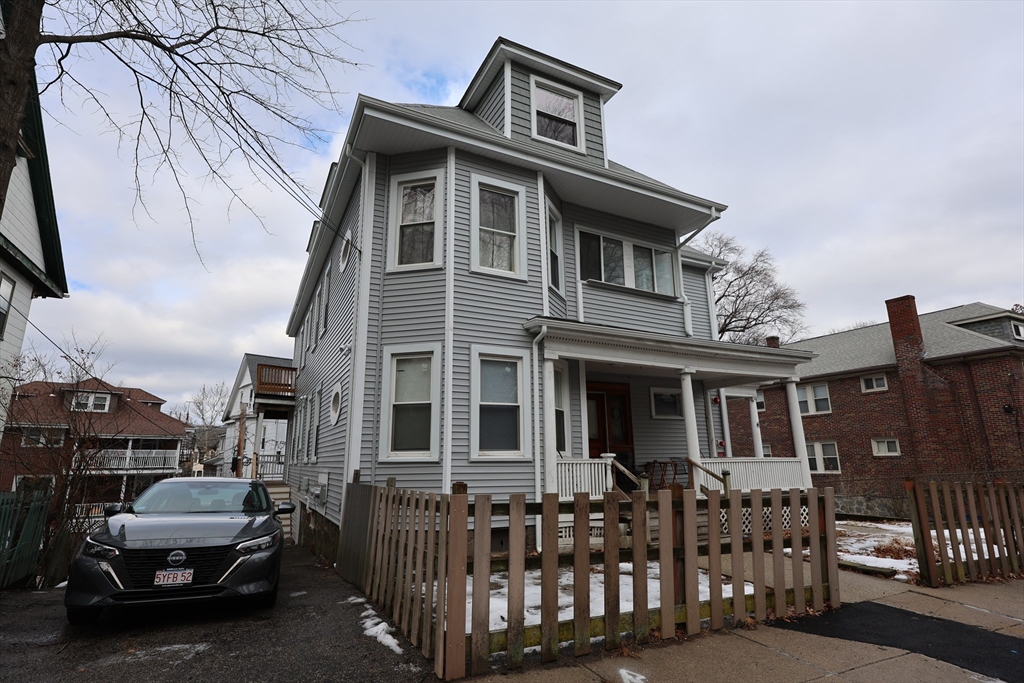 33-35 Ridgemont Street, Unit 1 Boston, MA 02134 - Photo 10 of 10 a front view of a house with glass windows