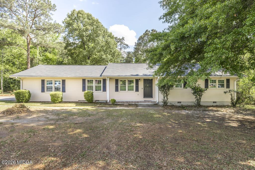 303 Woodhaven Road Centerville, GA 31028 - Photo 1 of 35 a view of a house with a yard and large tree