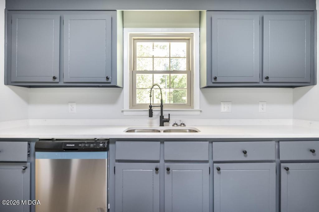 303 Woodhaven Road Centerville, GA 31028 - Photo 15 of 35 a kitchen with a sink cabinets and window