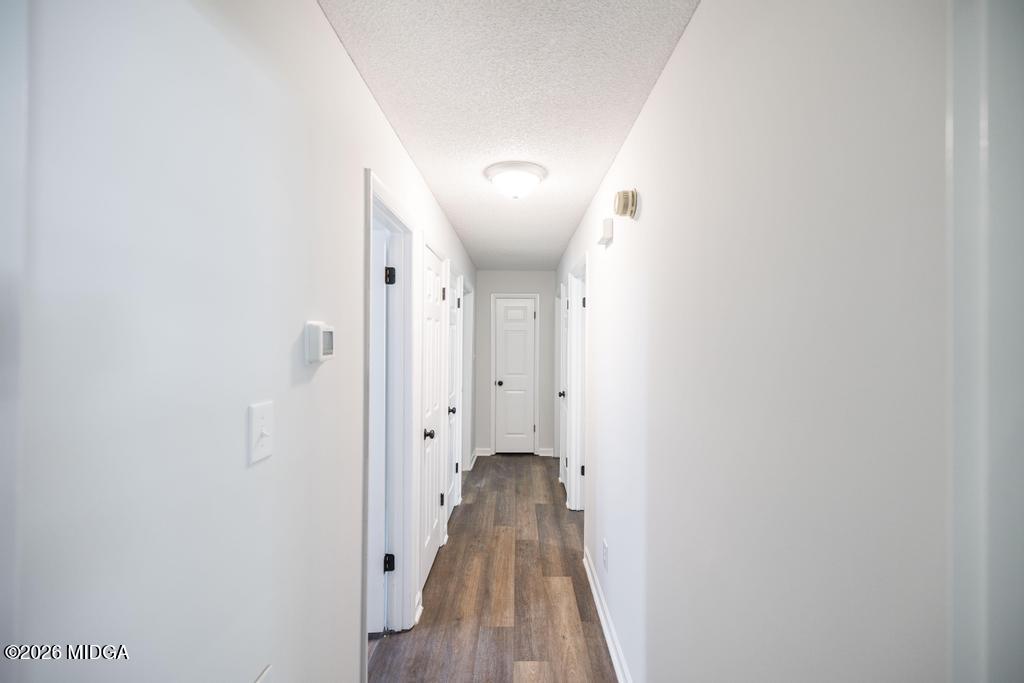 303 Woodhaven Road Centerville, GA 31028 - Photo 17 of 35 a view of a hallway with wooden floor