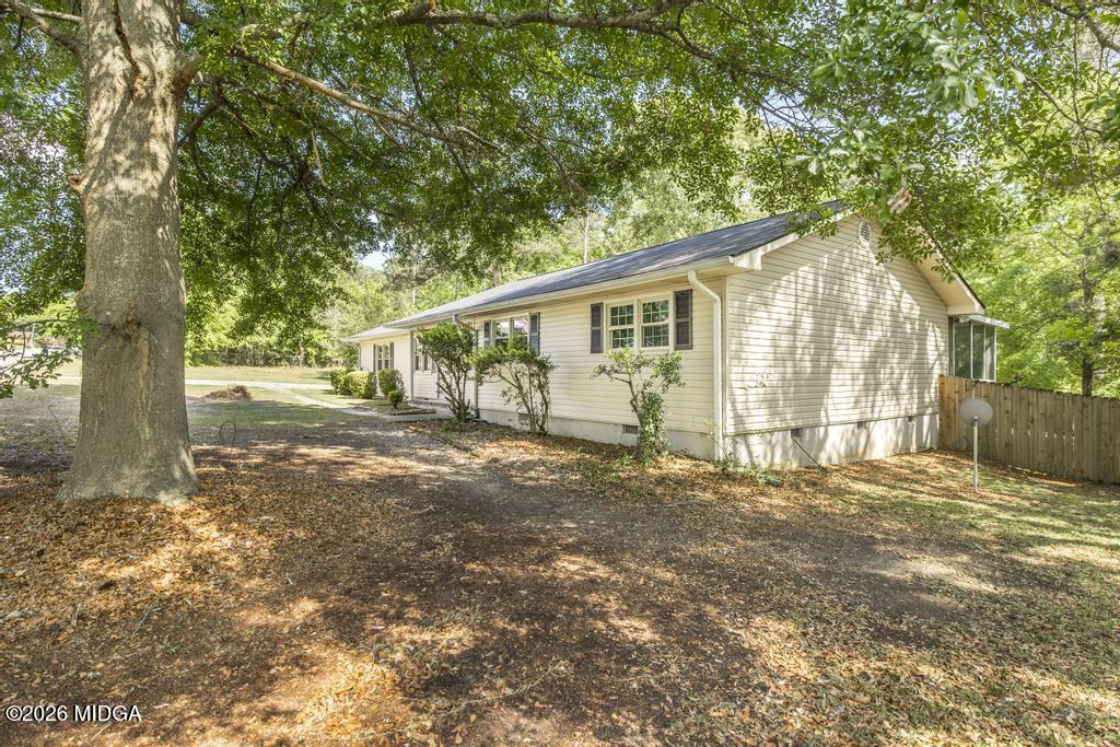303 Woodhaven Road Centerville, GA 31028 - Photo 2 of 35 a view of a house with a yard