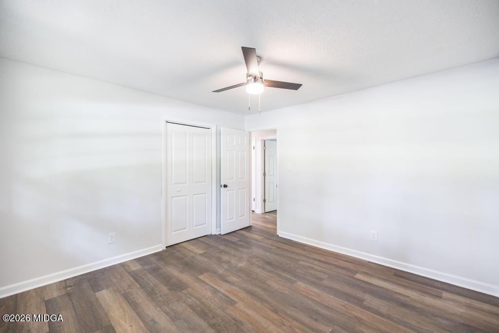 303 Woodhaven Road Centerville, GA 31028 - Photo 23 of 35 a view of an empty room with wooden floor