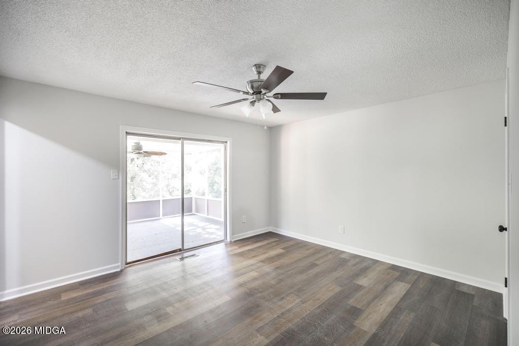 303 Woodhaven Road Centerville, GA 31028 - Photo 24 of 35 wooden floor in an empty room with a window