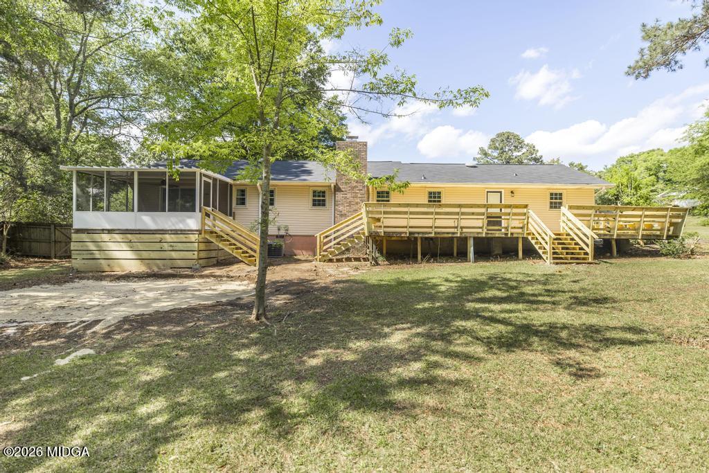 303 Woodhaven Road Centerville, GA 31028 - Photo 32 of 35 a view of a house with a yard