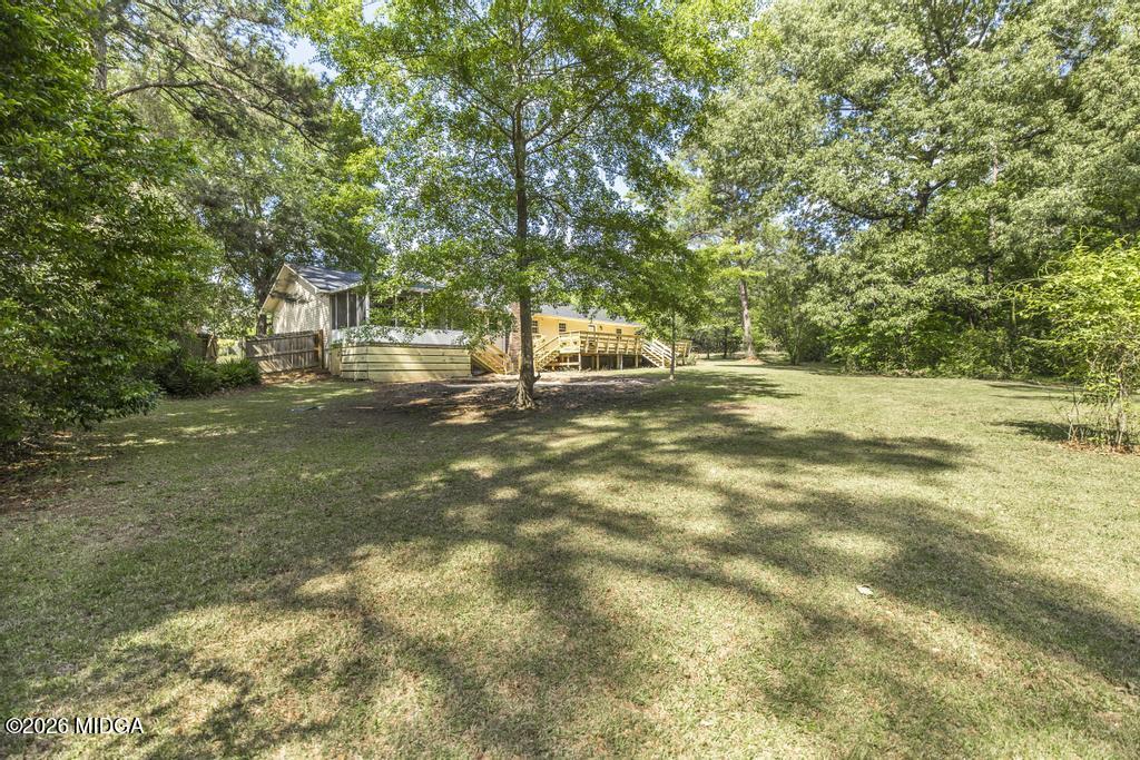 303 Woodhaven Road Centerville, GA 31028 - Photo 33 of 35 a view of a yard with a tree