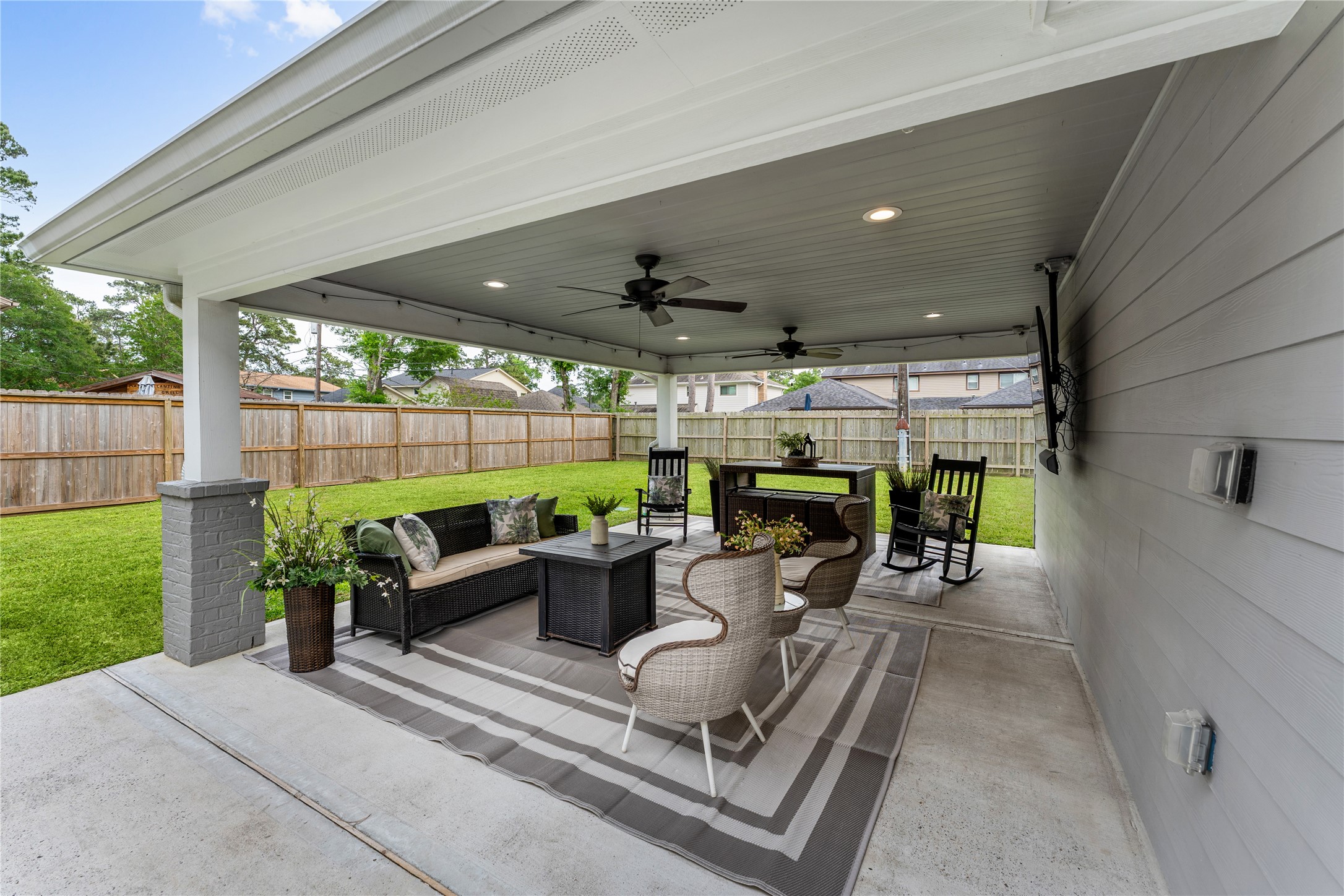 3301 Winter Lane Baytown, TX 77521 - Photo 24 of 28 Covered patio, features seating areas and a ceiling fan. The area provides a great space for outdoor relaxation and entertaining day or night.