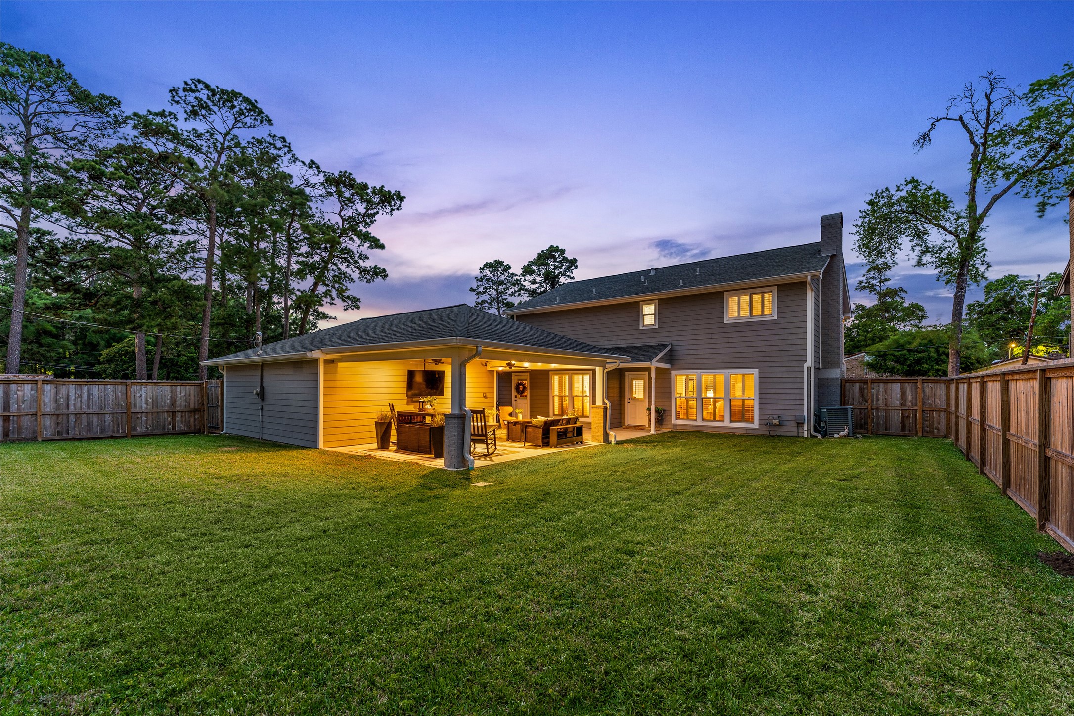 3301 Winter Lane Baytown, TX 77521 - Photo 27 of 28 Covered patio, features seating areas and a ceiling fan. The area provides a great space for outdoor relaxation and entertaining day or night.