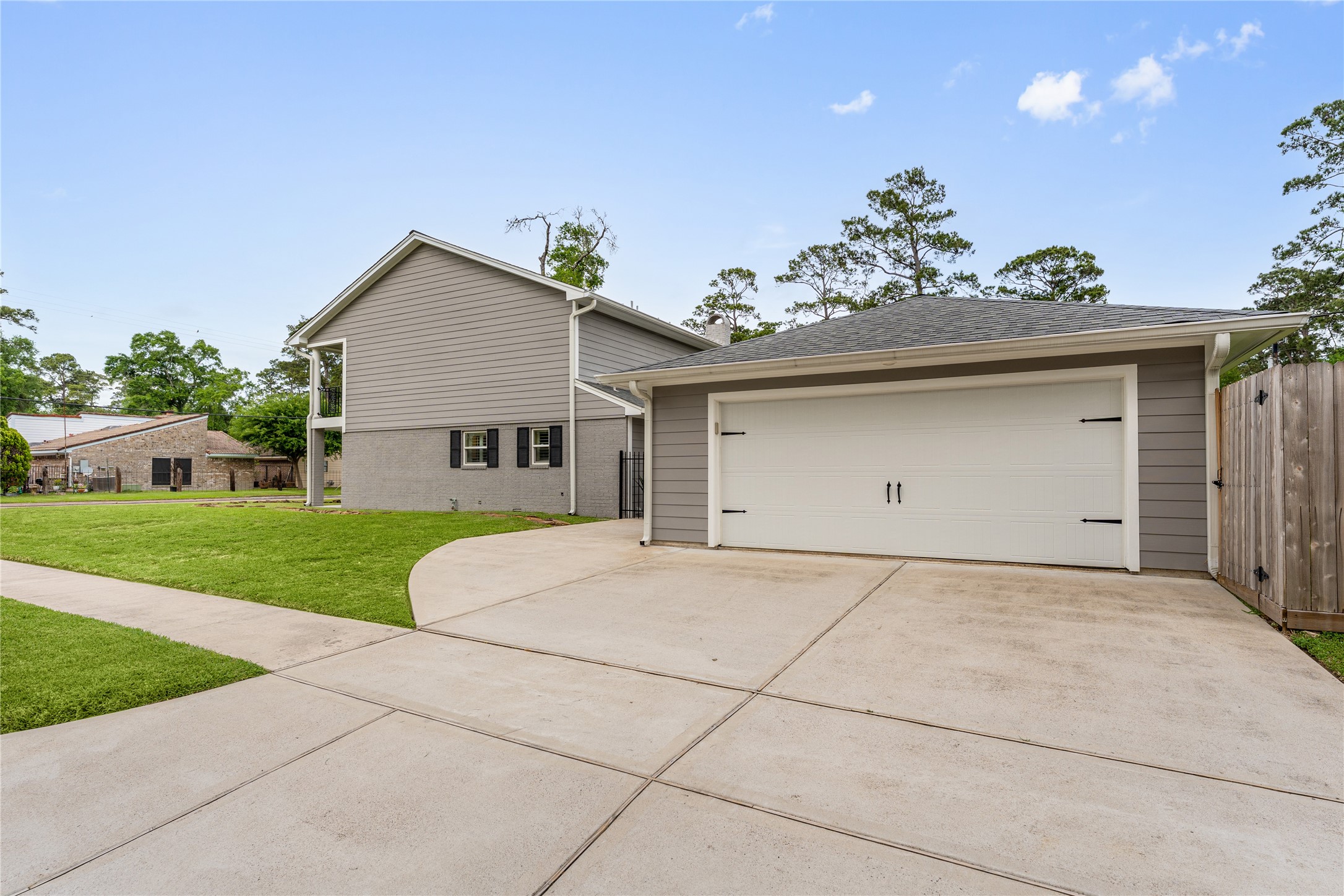 3301 Winter Lane Baytown, TX 77521 - Photo 28 of 28 Spacious driveway leading to a two-car garage.