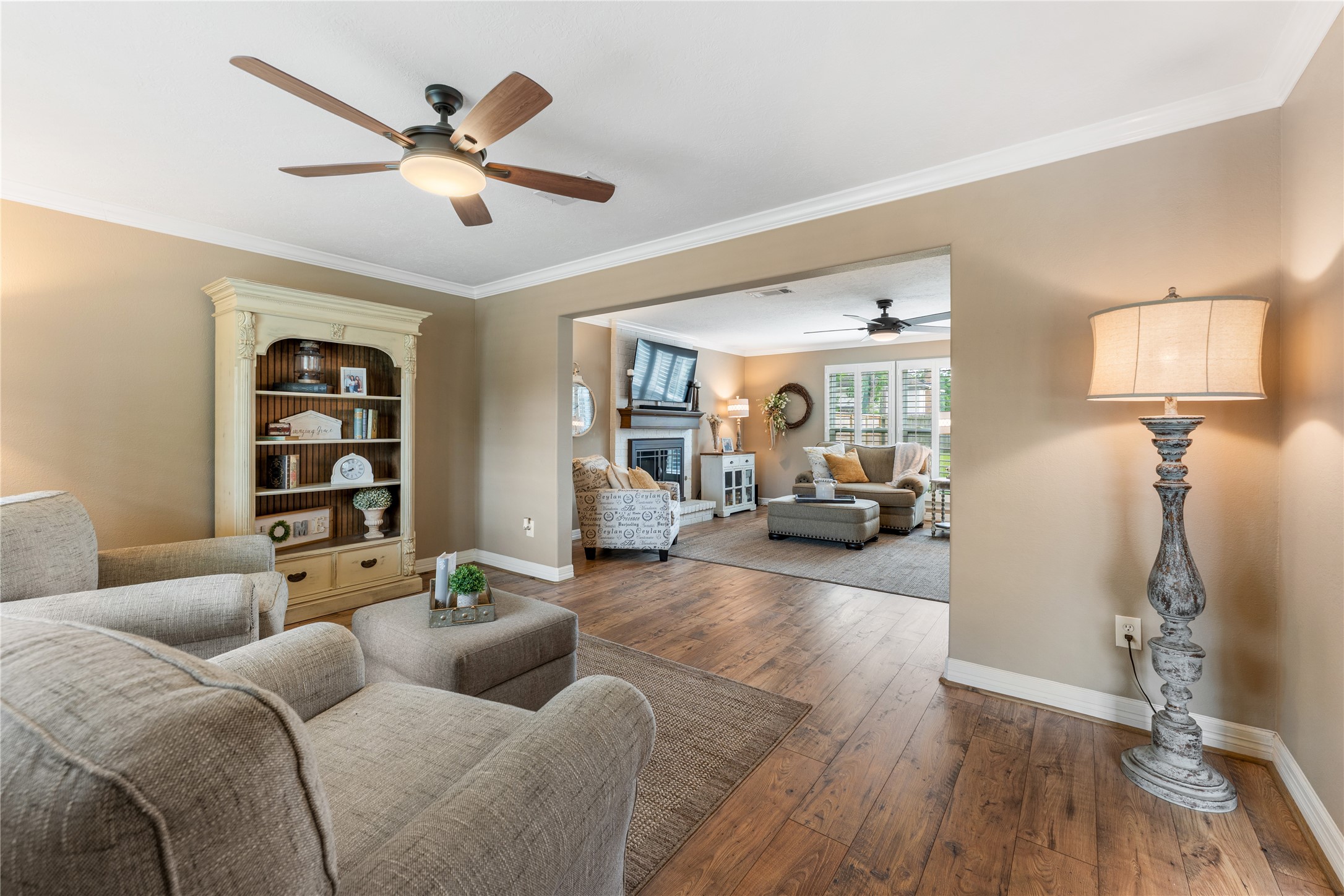 3301 Winter Lane Baytown, TX 77521 - Photo 10 of 28 This cozy family room features neutral walls, creating an inviting atmosphere. Large windows with plantation shutters let in natural light.