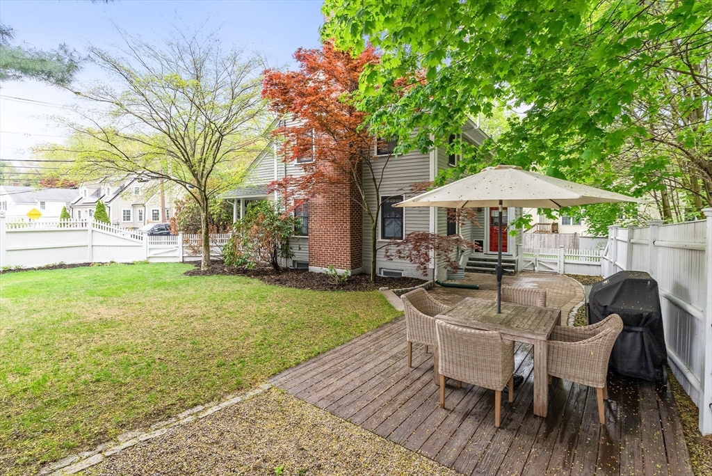 571 Washington Street Winchester, MA 01890 - Photo 2 of 35 a view of a backyard with sitting area and furniture