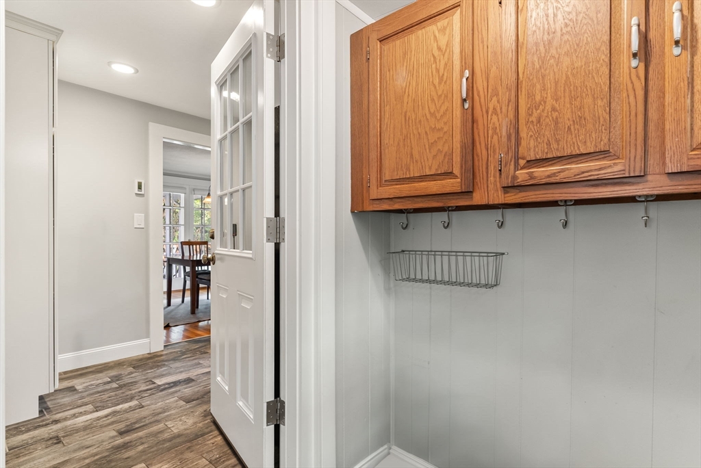571 Washington Street Winchester, MA 01890 - Photo 26 of 35 an entryway with wooden floor and cabinet