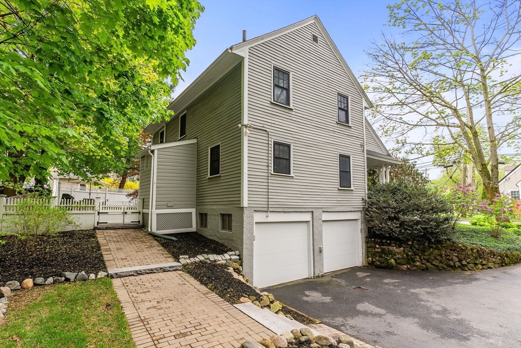 571 Washington Street Winchester, MA 01890 - Photo 32 of 35 a view of a small house with a yard