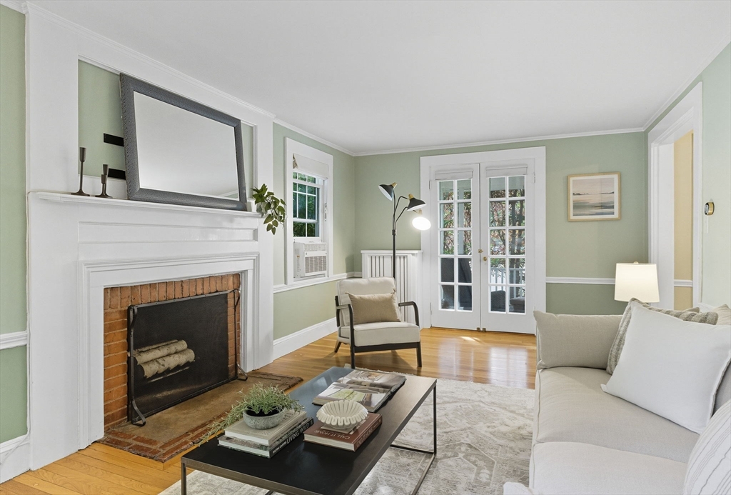 571 Washington Street Winchester, MA 01890 - Photo 6 of 35 a living room with furniture and a fireplace