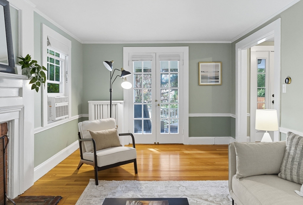 571 Washington Street Winchester, MA 01890 - Photo 7 of 35 a living room with furniture and a fireplace