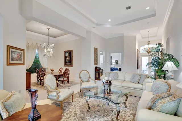 a living room with furniture and a lamp