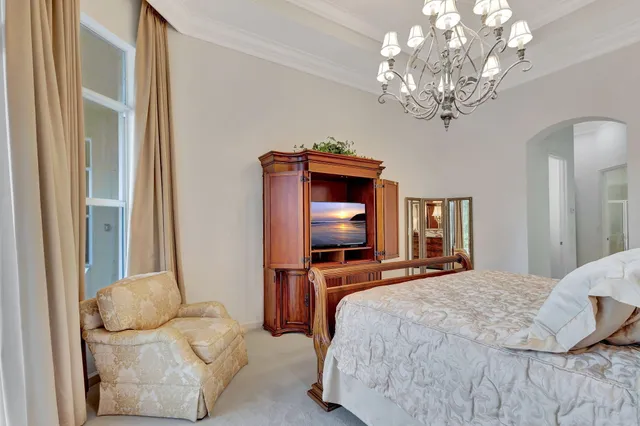 a view of a swimming pool with lounge chair