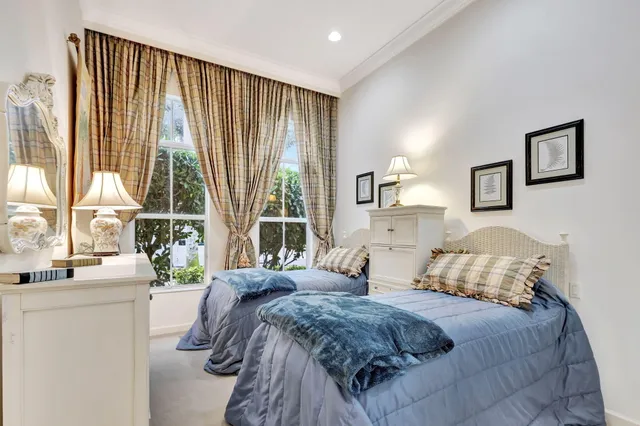 a view of a swimming pool with a yard and a garden