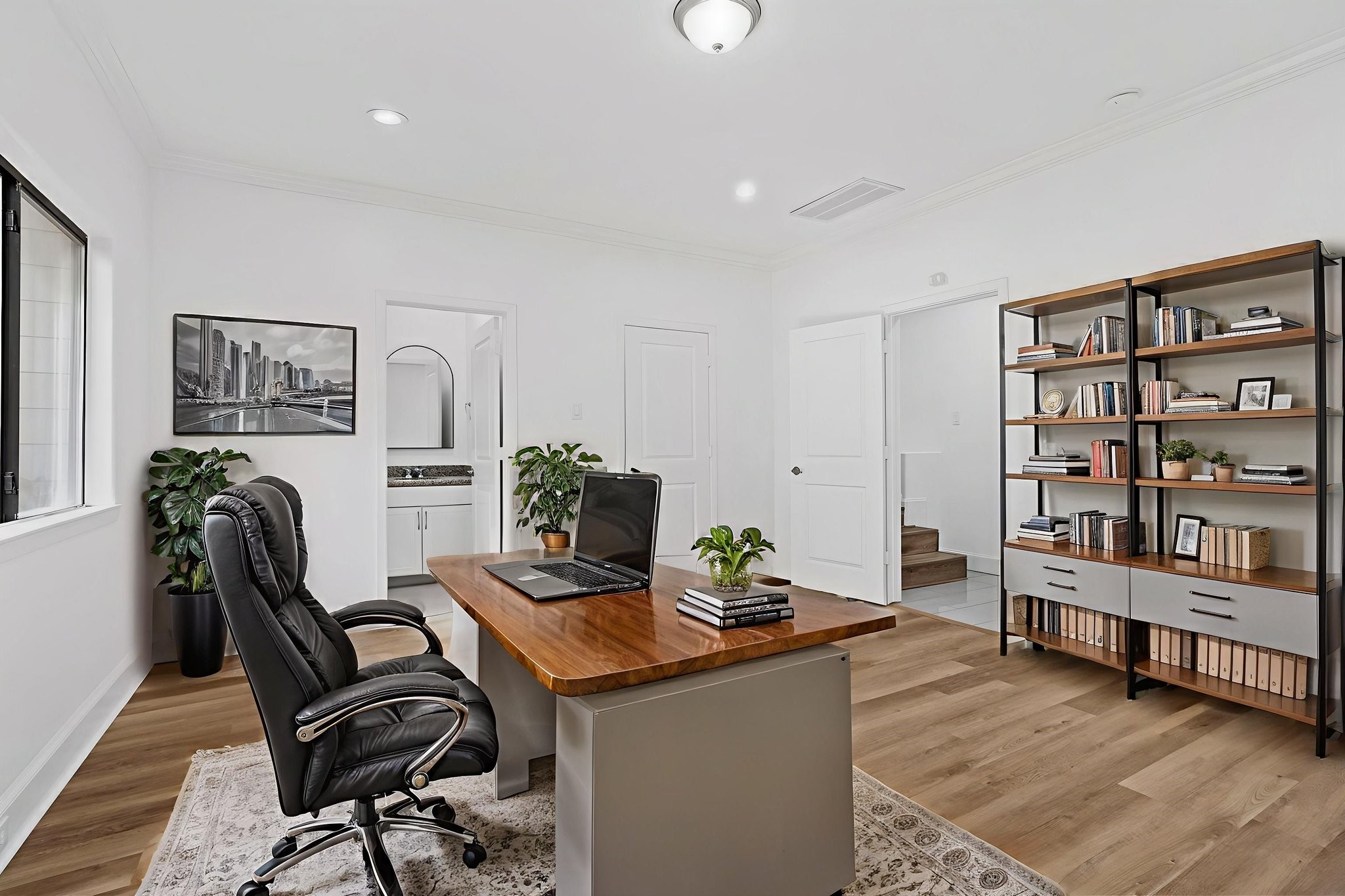2547 Rusk Street Houston, TX 77003 - Photo 4 of 22 a view of a workspace with furniture and wooden floor