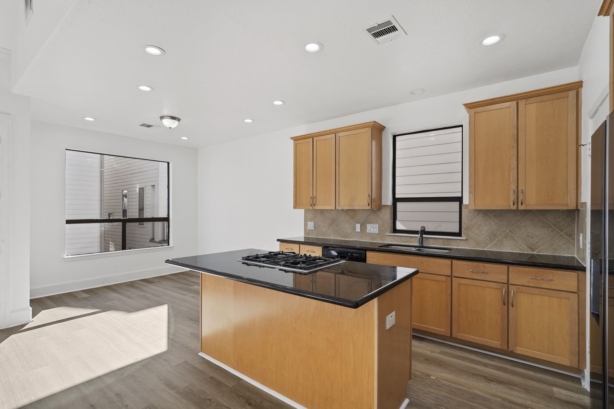 2547 Rusk Street Houston, TX 77003 - Photo 8 of 22 a kitchen with stainless steel appliances granite countertop a sink stove and refrigerator