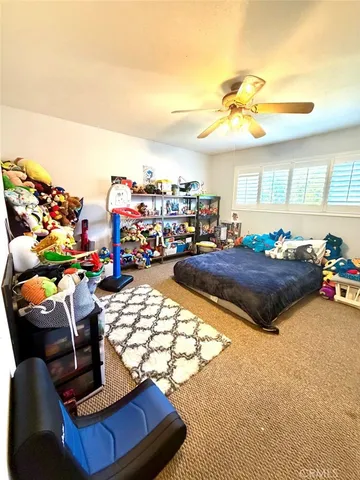 a living room with lots of furniture and a chandelier
