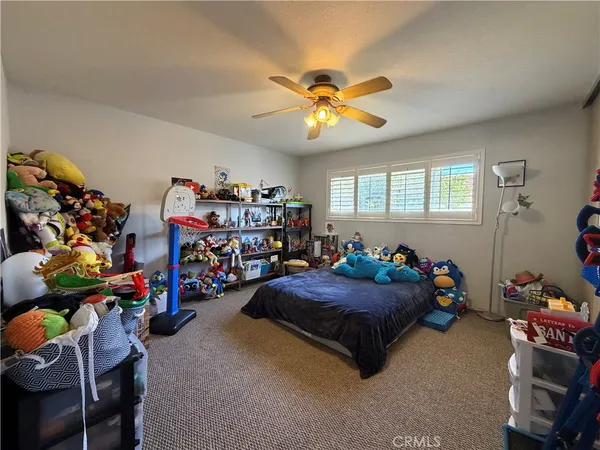 a bed room with furniture and a window