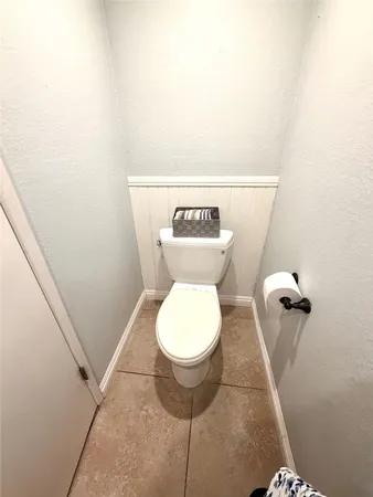 a bathroom with a toilet and a sink