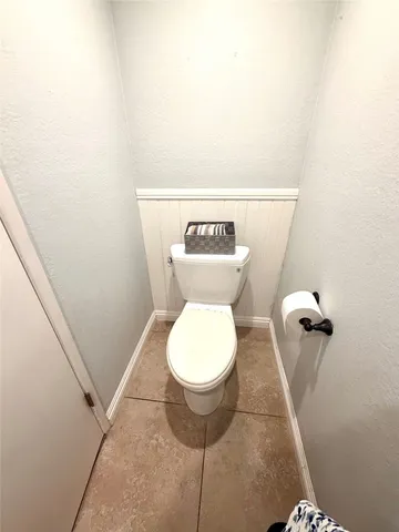 a bathroom with a toilet and a sink