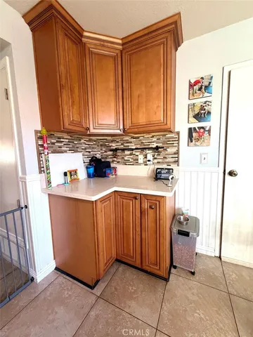 a kitchen with stainless steel appliances granite countertop a refrigerator and a stove