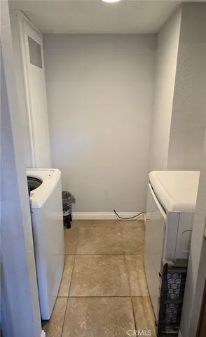 a view of a storage & utility room with a sink