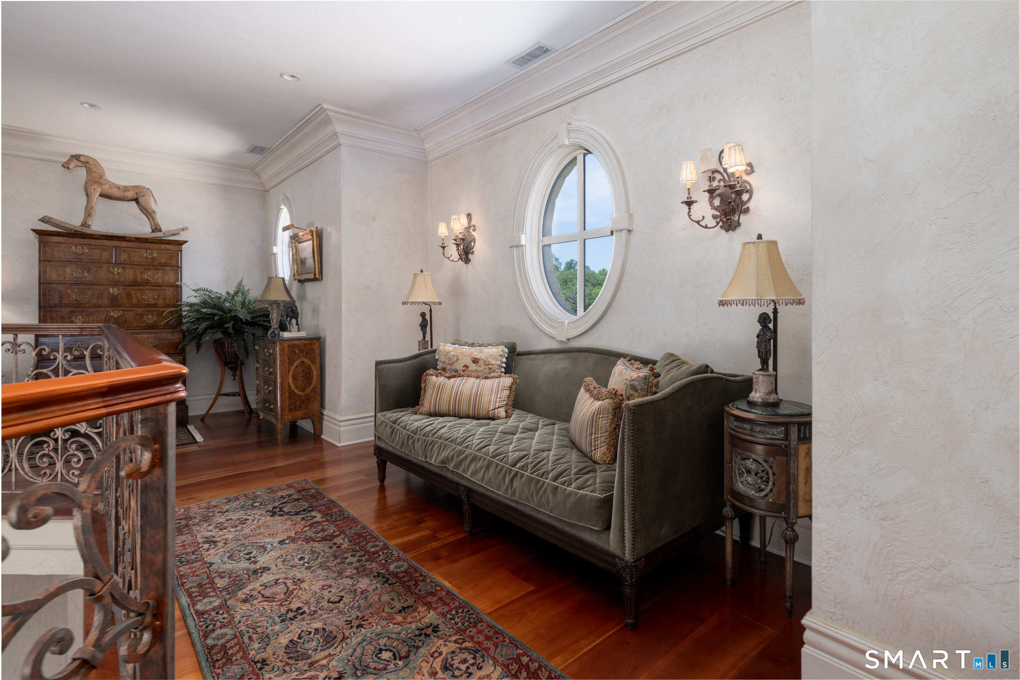 7 Equestrian Ridge Newtown, CT 06470 - Photo 34 of 40 a living room with furniture a rug and a fireplace