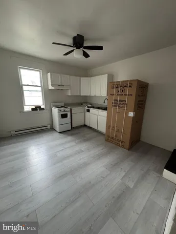 a floor to ceiling window and a rug