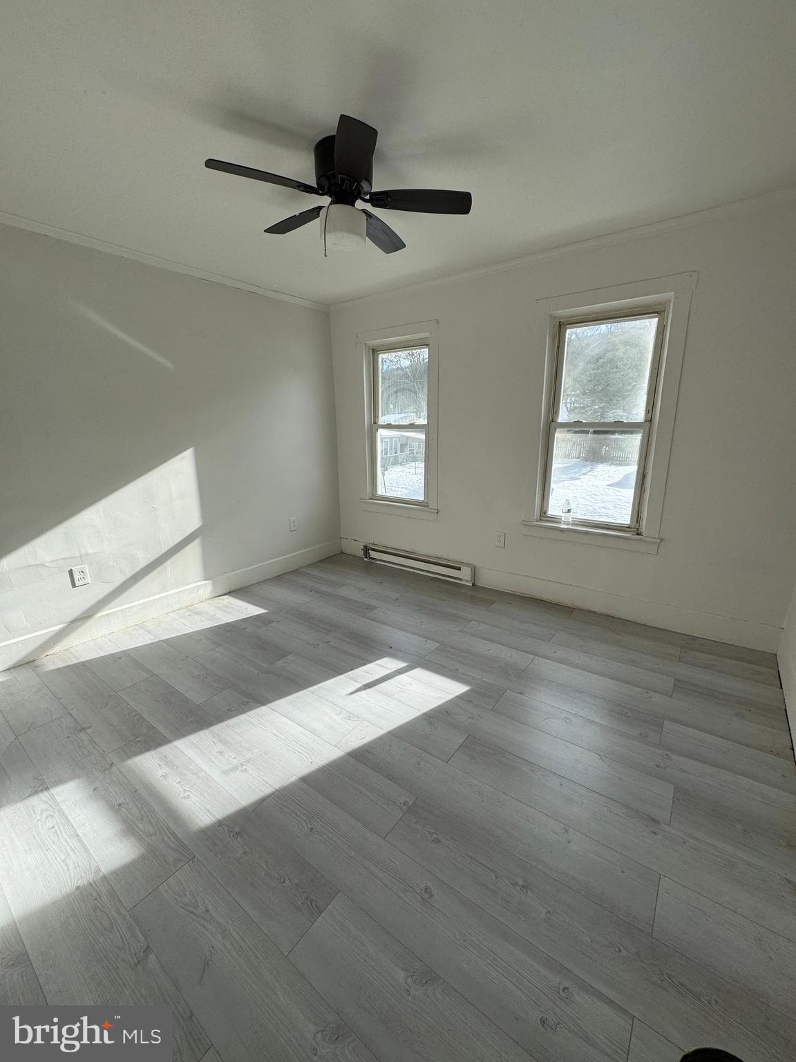 1931 Walnut Street Ashland, PA 17921 - Photo 5 of 6 a view of empty room with wooden floor and fan