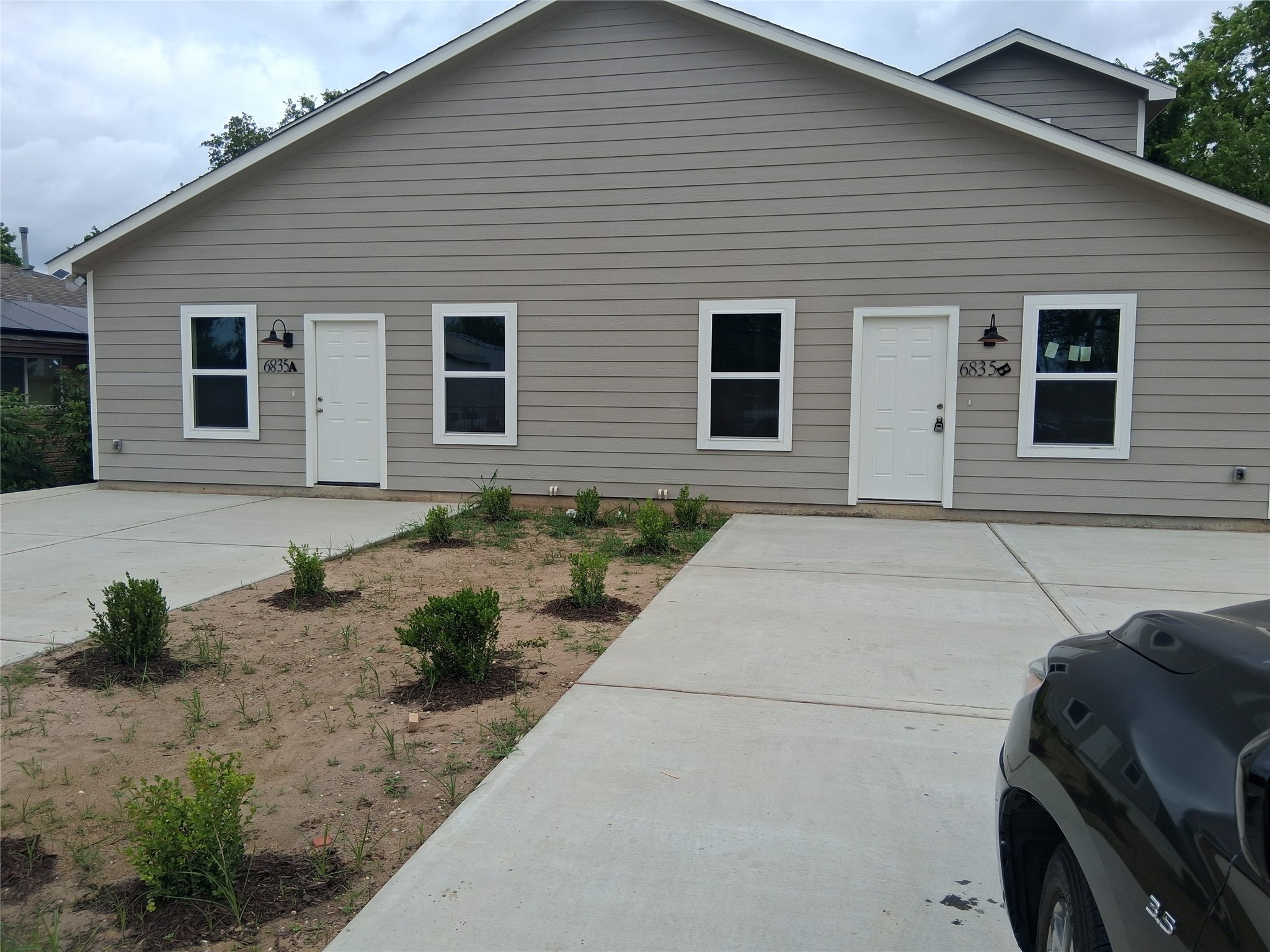 6835 Landor Street Houston, TX 77028 - Photo 1 of 32 a front view of a house with garden