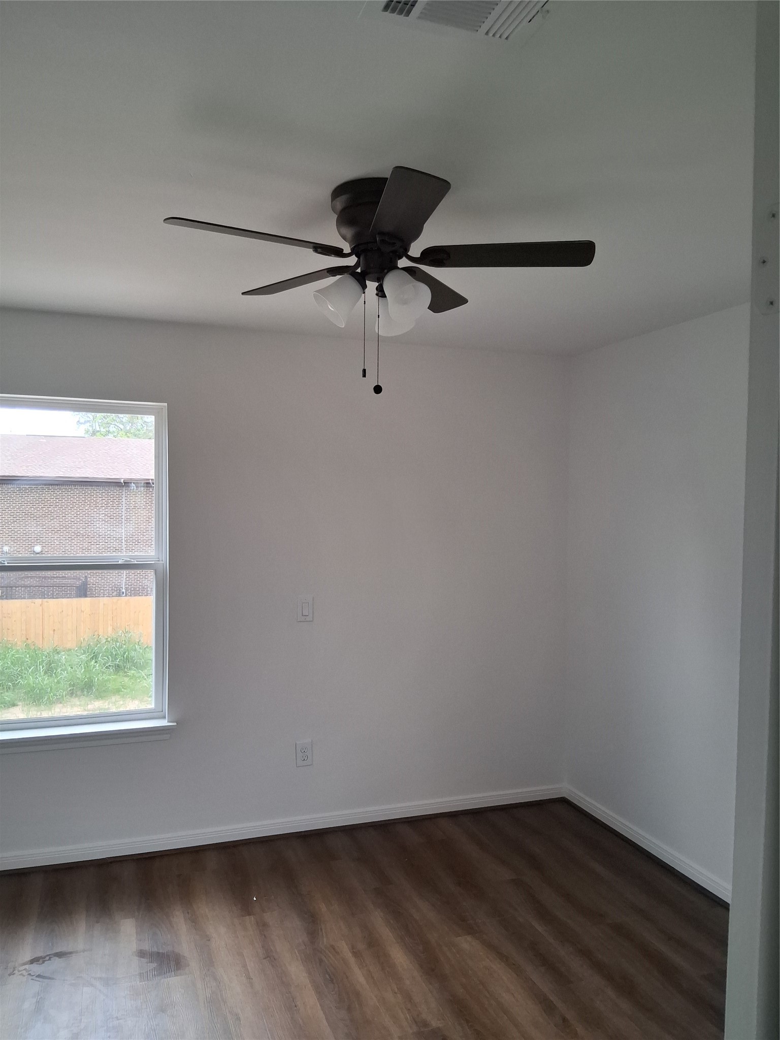 6835 Landor Street Houston, TX 77028 - Photo 20 of 32 a view of a small space with wooden floor and a window