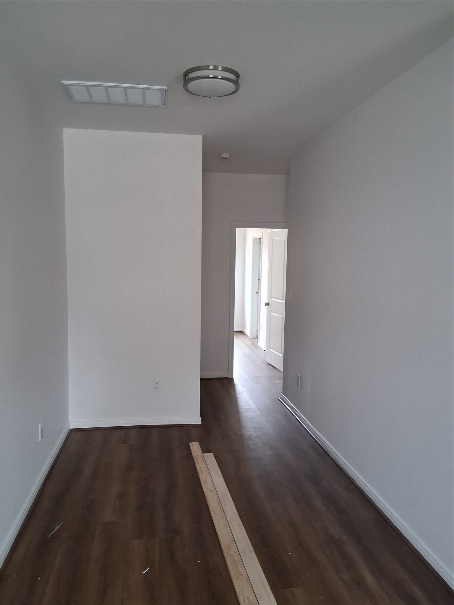6835 Landor Street Houston, TX 77028 - Photo 21 of 32 a view of a hallway with wooden floor