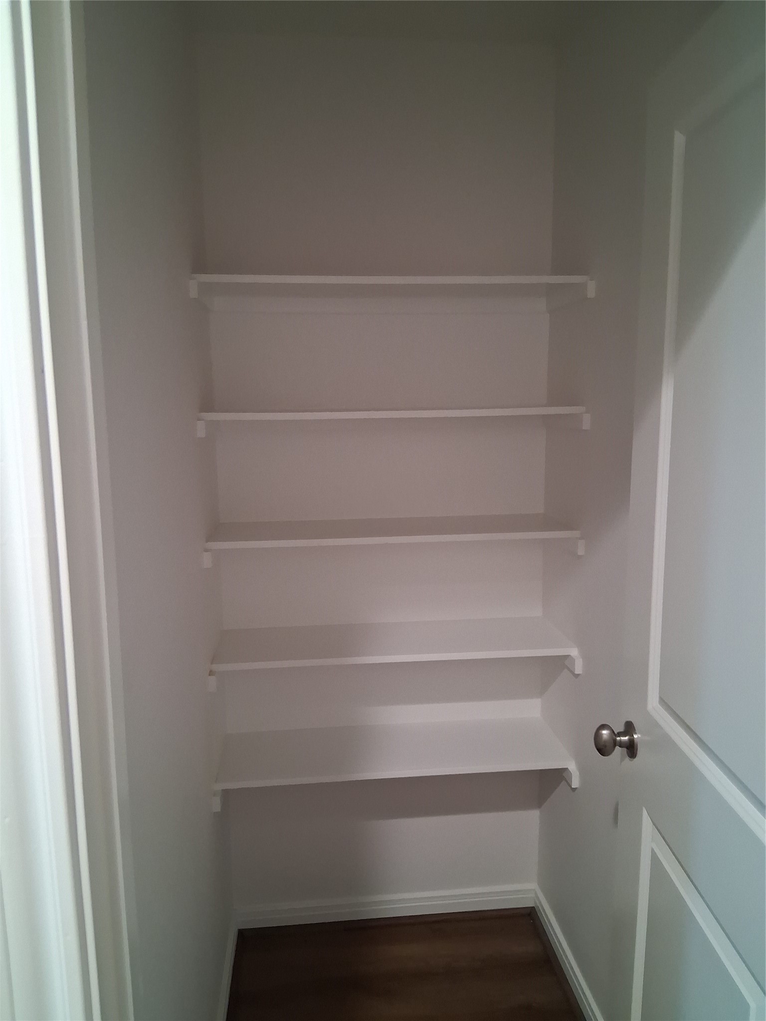 6835 Landor Street Houston, TX 77028 - Photo 28 of 32 a view of walk in closet with empty racks