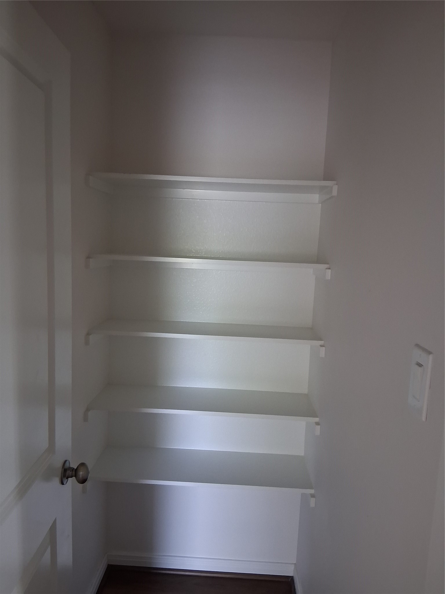 6835 Landor Street Houston, TX 77028 - Photo 10 of 32 a view of walk in closet with empty racks