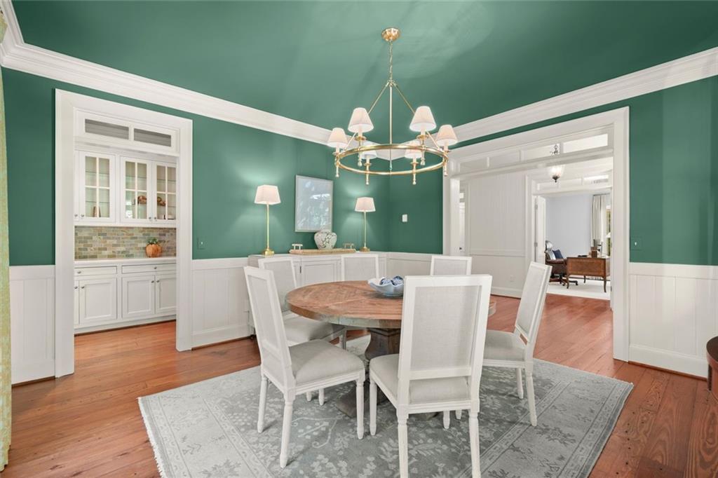 1450 Acworth Due West Road Northwest Kennesaw, GA 30152 - Photo 11 of 77 a view of a dining room with furniture and wooden floor