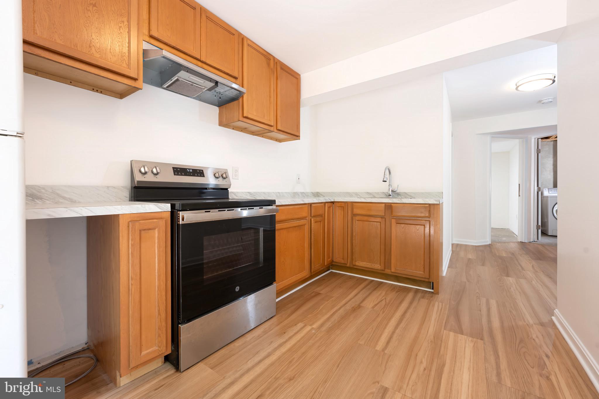 5490 Prince William Court Frederick, MD 21703 - Photo 21 of 25 Lower level kitchen