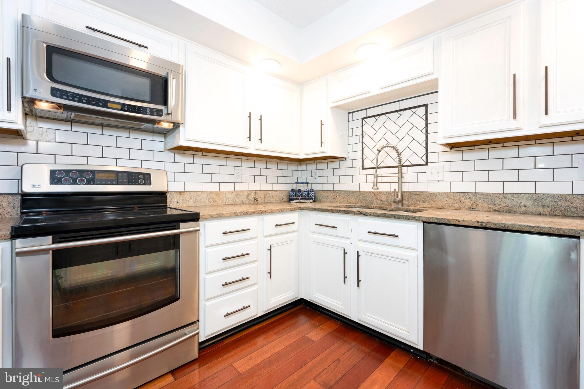 5490 Prince William Court Frederick, MD 21703 - Photo 8 of 25 Remodeled granite and stainless steel kitchen
