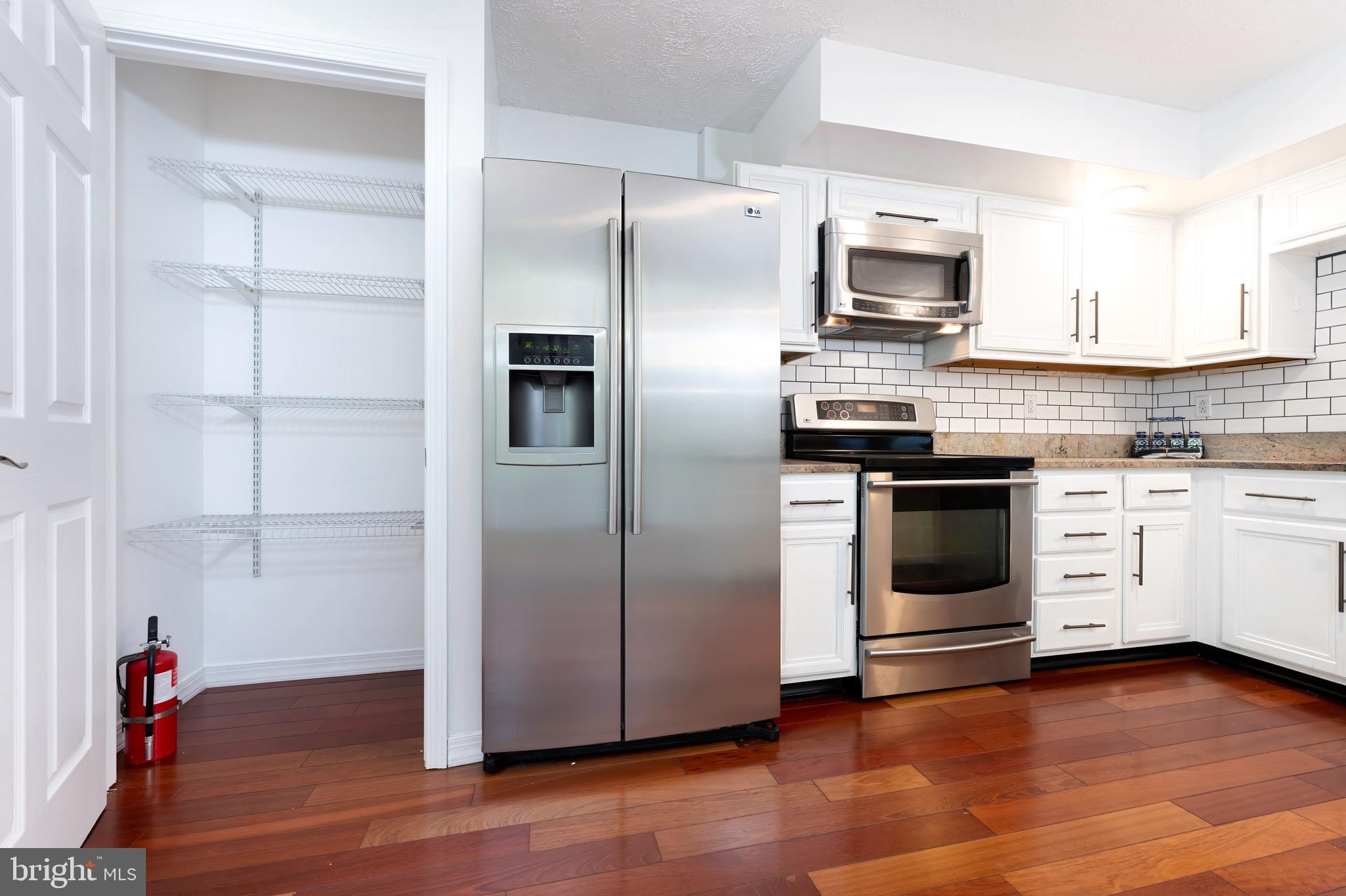 5490 Prince William Court Frederick, MD 21703 - Photo 9 of 25 Remodeled granite and stainless steel kitchen