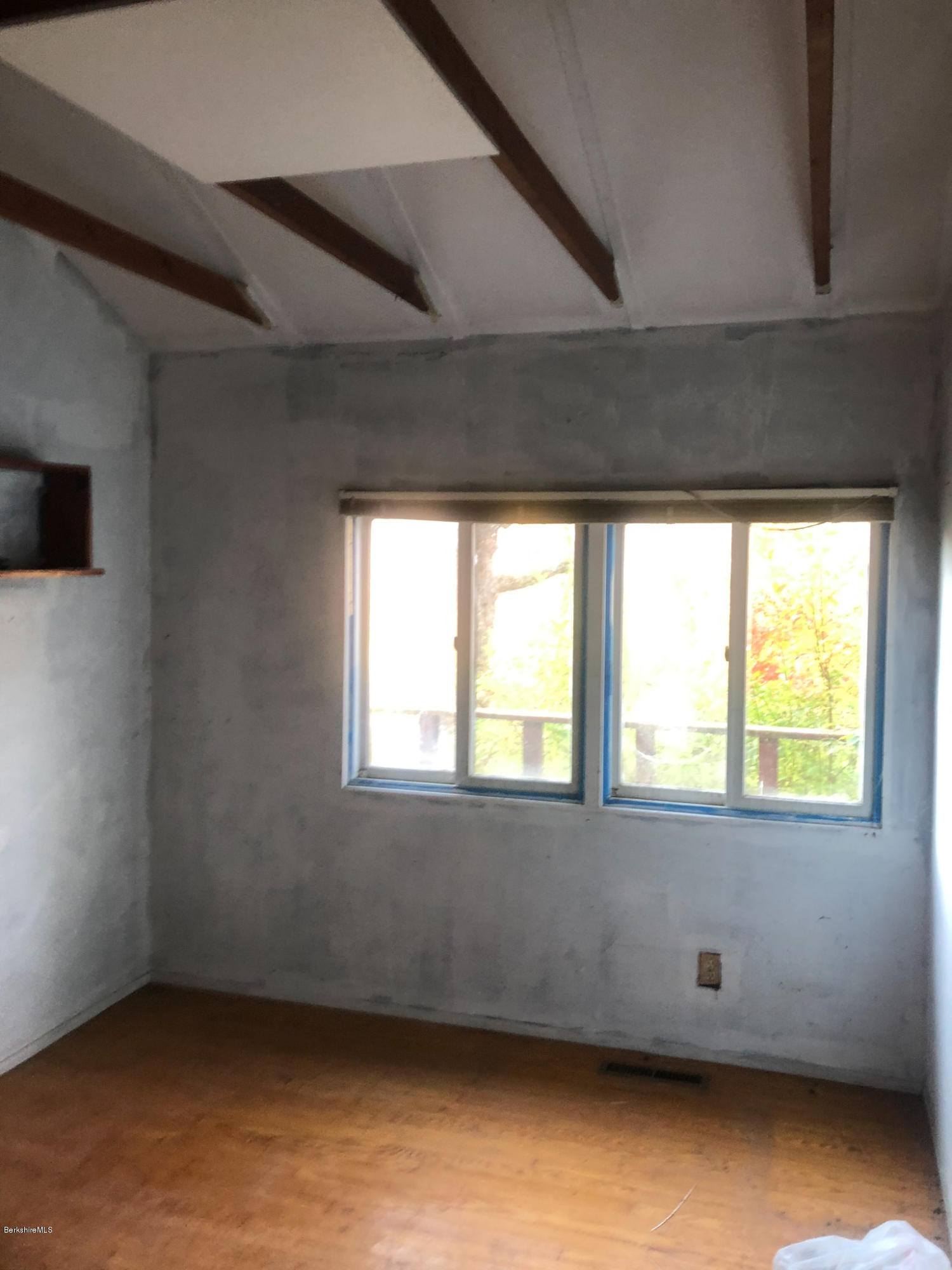 17 Bailey Road Worthington, MA 01098 - Photo 14 of 35 a view of an empty room with wooden floor and a window