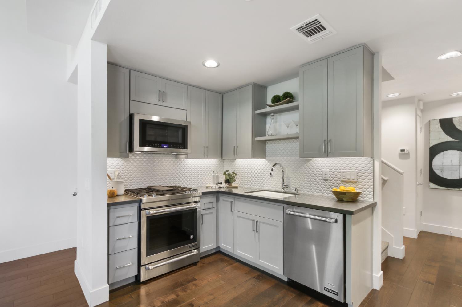 2746 5th Street Davis, CA 95618 - Photo 14 of 61 a kitchen with a sink and a stove top oven with wooden floor