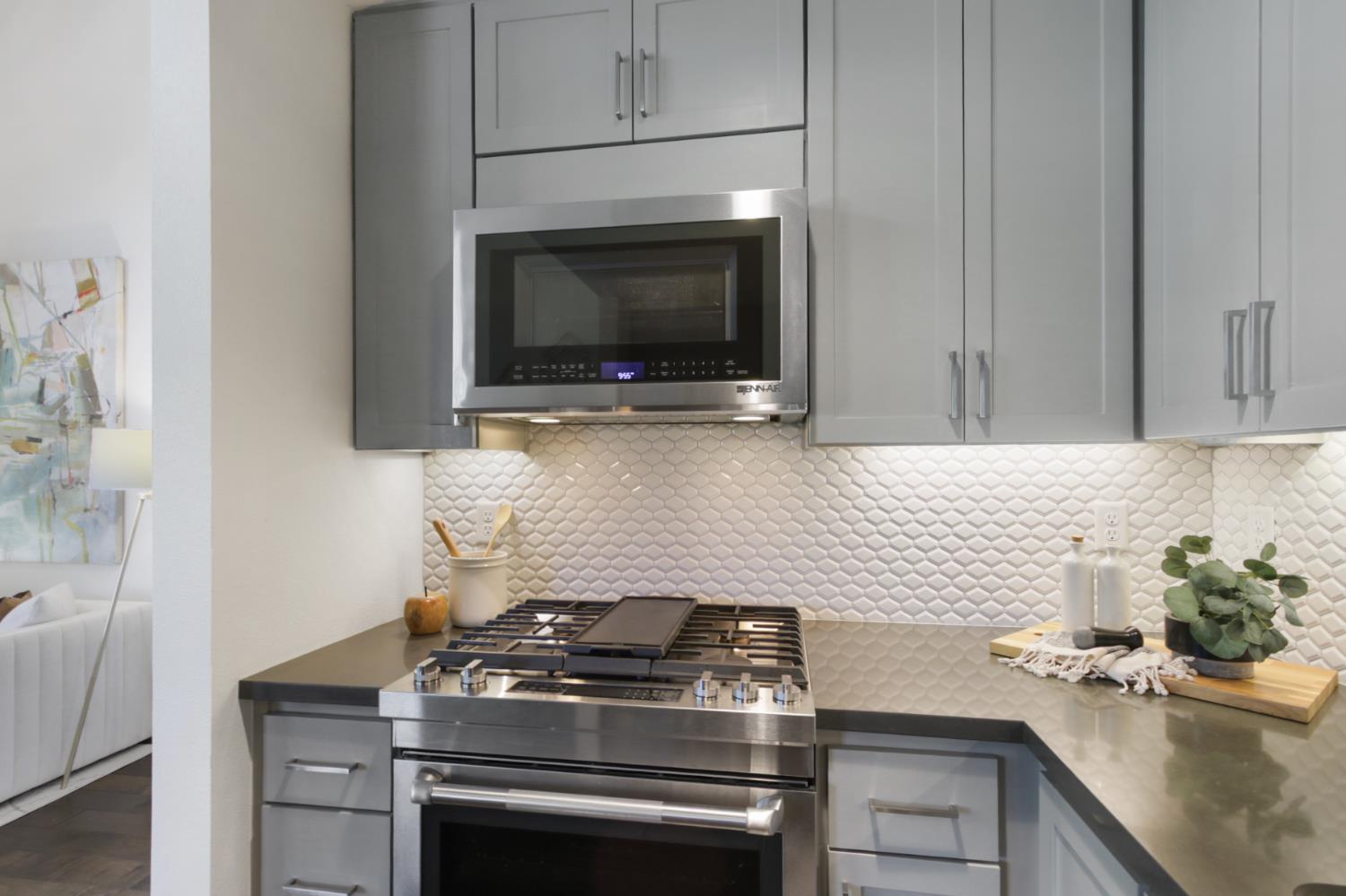 2746 5th Street Davis, CA 95618 - Photo 19 of 61 a kitchen with a stove and a microwave