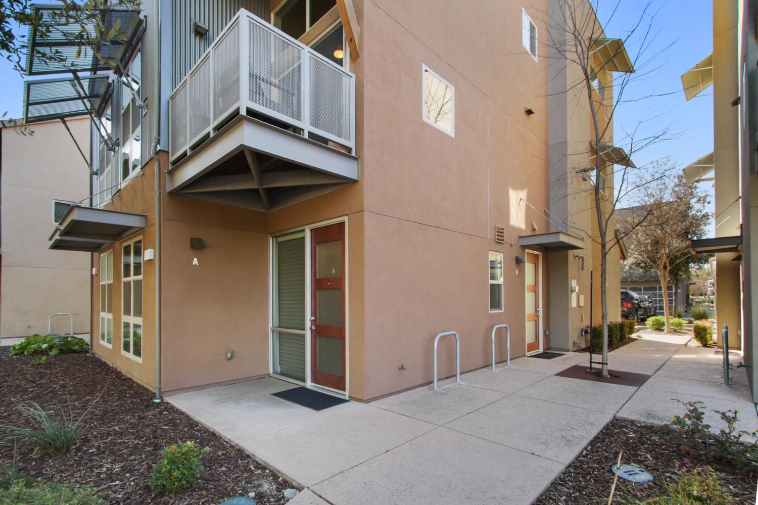 2746 5th Street Davis, CA 95618 - Photo 2 of 61 a view of a brick house with many windows