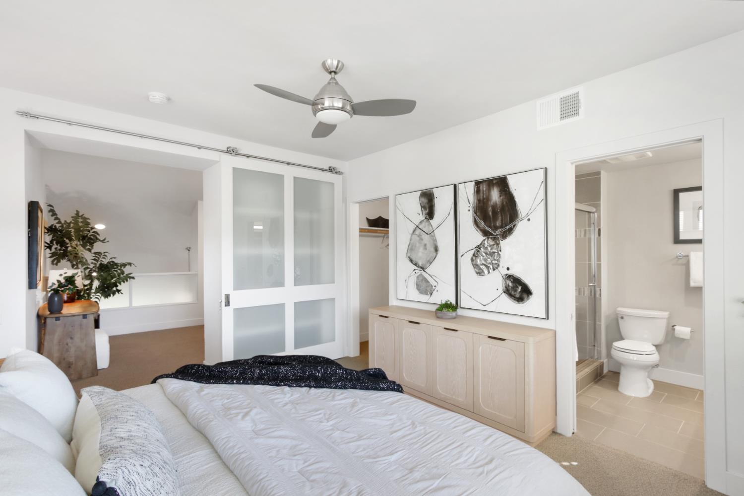 2746 5th Street Davis, CA 95618 - Photo 30 of 61 a bedroom with a large bed and a window